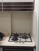 Облицовка каминная Наши работы (индивидуальные) Экран кухонного шкафчика от жара
